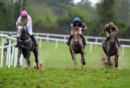 Champagne Fever (left) leads runner-up <br>Melodic Rendezvous (centre) off the final bend