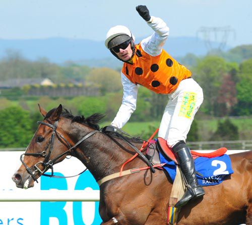 Ronan McNally salutes the crowd passing the post on See Double You