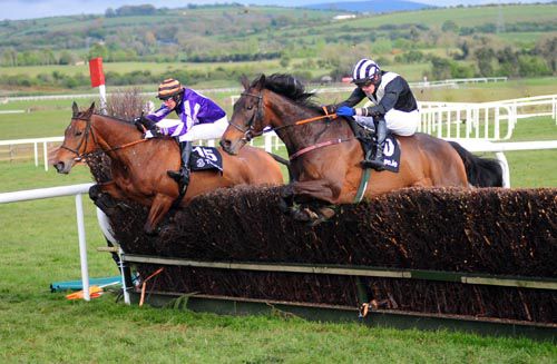 Caduceus under Paul Townend (nearest) jumps the last alongside Miss Pepperpot
