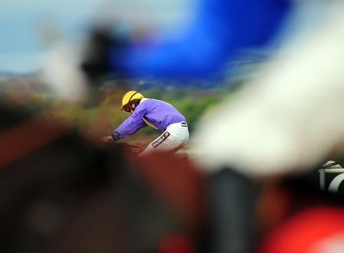 Patrick Mullins is seen under the arms of Declan Lavery who's mount Some Tikket ran out