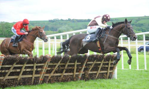 Missunited under Bryan Cooper jumps the last in front of Top Madam