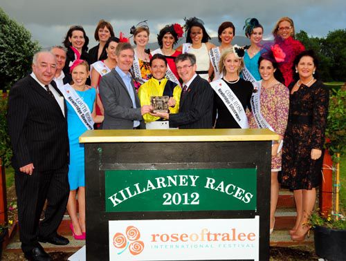 Katie Walsh and Barry Connell are presented their prizes surrounded by Rose Of Tralee contestants