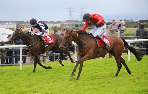 Another Charm, right, gets up to beat Tasitiocht in the last race of the Galway Festival