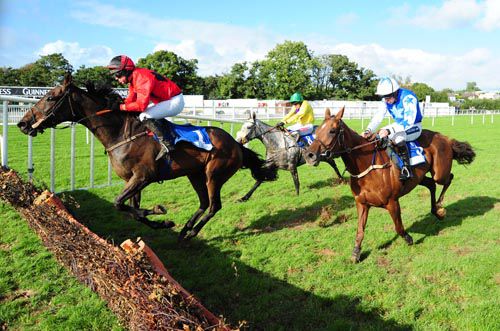 Rising Time jumps the last ahead of Chiltern Hills (blue) and the grey Tropical Three