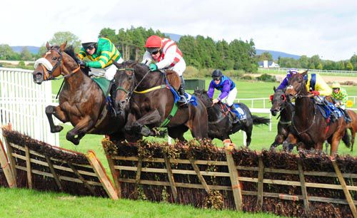 Cloudgazer (red cap) jumps the last with Tobar Na Gaoise