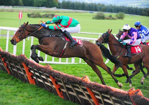 Heaney (Paul Townend) leads at the last in the three miles handicap hurdle