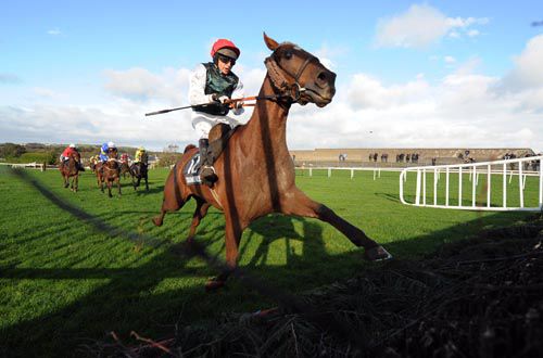 An untidy jump by Days Ahead at the seventh fence