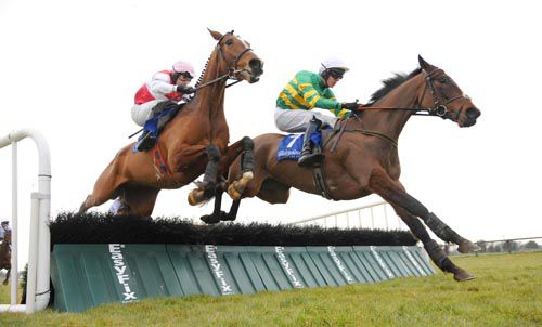 Corbally and Mark Walsh (right) jump the last ahead of Kilmainham 