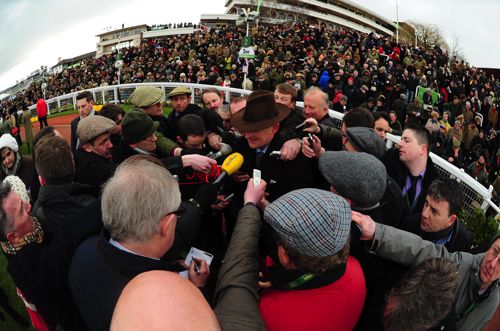 Willie Mullins surrounded by reporters at Cheltenham