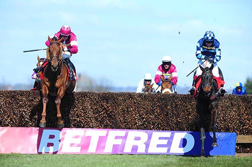First Lieutenant (left) jumps the last on his way to victory in the Betfred Bowl at Aintree earlier this year