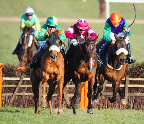 Dancing Tornado (blinkers) races away from the last ahead of Stonemaster (centre) and Shop Dj 