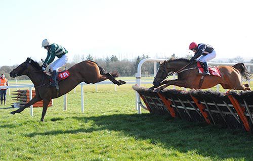 Teochew clears the last under Donal McAuley from Get Off The Stage in second