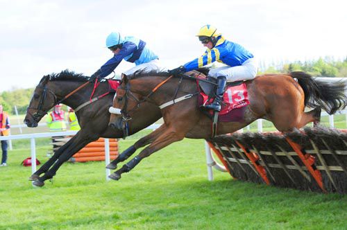 The Boat People jumps the last just ahead of Foot Soldier