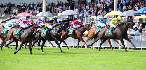 Burn The Boats (yellow with noseband) is driven out to score by Gary Carroll