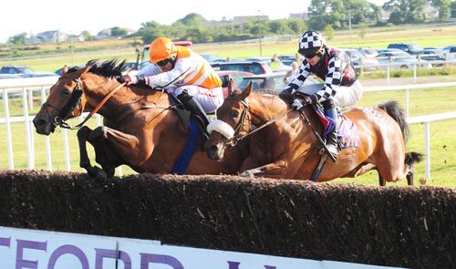 Acapulco Gold jumps the last under Davy Russell (left) as Drumlister is about to unseat Gareth Malone