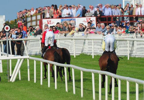 Sabaidee just has the loose horse, Crystal Earth, for company passing the line