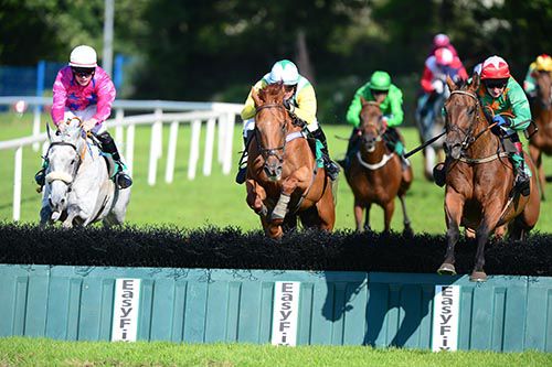 King High (right) jumps the last just ahead of Vintage Supreme (centre) and Derrinlanna