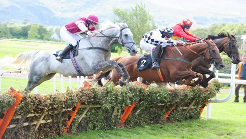 Baidin Fheilimi (centre) jumps the last alongside Ballyfinboy (grey) and Shantalla