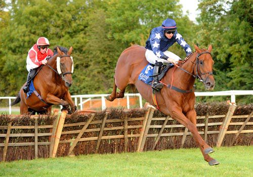 Grove Field clears the 2nd last with Wrong Way Corrigan in pursuit