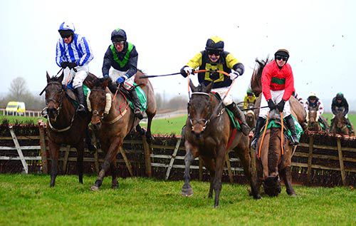 The Bugler is about to fall at the last as Wither Hills (2nd left) mounts a challenge
