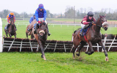 Layla Joan (right) and Paul Carberry jump the final hurdle ahead of Tudor Fashion 