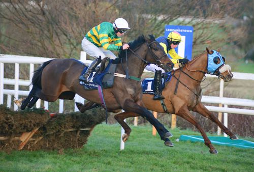 Gilgamboa (nearside) and Flaxen Flare battle it out over the last at Leopardstown