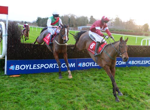 Folsom Blue clears the last with Sole Witness (left) in second