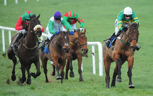 On The Fringe (right) leads Tammys Hill (white jacket) to the final fence