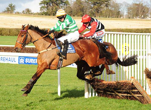 Claire Pet and Mick Darcy jump the last 
