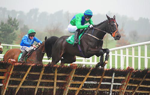 Whisper Rock (Kevin Power) jumps the last at Navan ahead of Killeena House