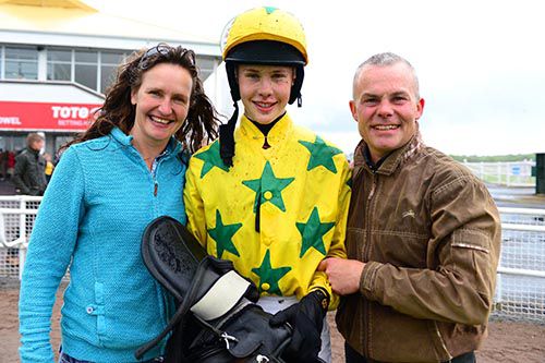 Jockey Finian Maguire with his parents Sabrina and Adrian Maguire