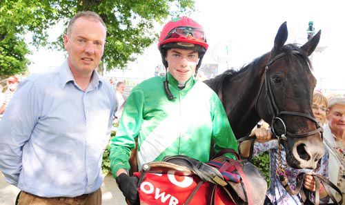 Kevin O'Donnell with his son Philip after Dubh Eile won the bumper for them Gowran