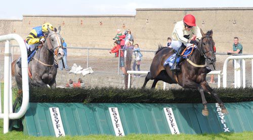 Cut The Corner jumps the last under Adrian Heskin with the grey Royal Chief on his inside