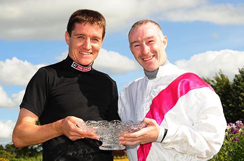 Barry Geraghty, representing At The Races, presents David Casey with his prize