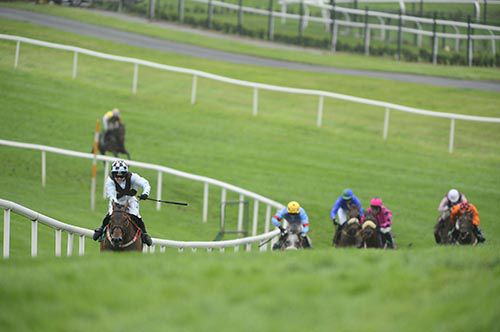Young Dillon and Katie Walsh climb the hill in a clear lead