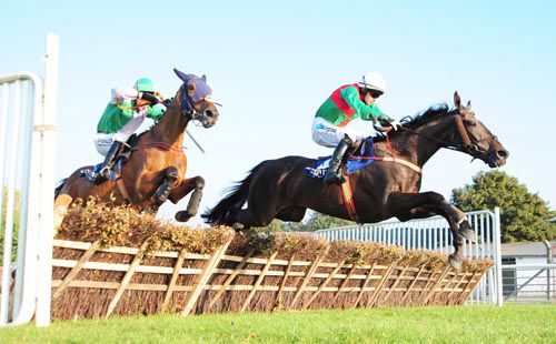 Saltmills Blackie clears the last under Jonathan Burke with Dun Scaith in second 