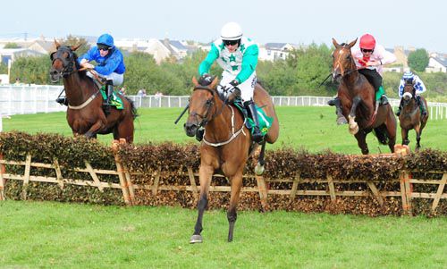 Memories Of Milan (right) jumps the last to win from Buster Dan Dan (centre) and Wells China (left) 