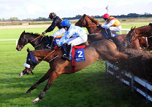 The King Of Brega (far side) jumps the last alongside runner-up Formal Bid (2)