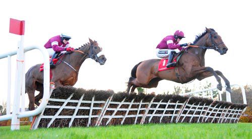 Alpha Des Obeaux and Bryan Cooper jump the last in front
