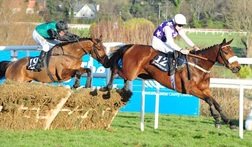 Katie T (Brian Hughes) leads Modem over the last in the BoyleSports Hurdle