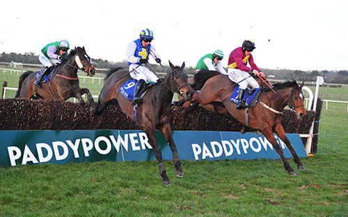 Bothair Clei (far side) jumps the last alongside Miss Xian