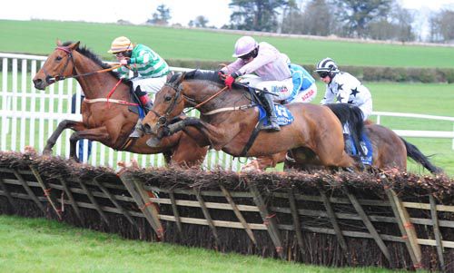 Jo Go and Davy Condon (nearest) clear the last alongside Claire Pet 