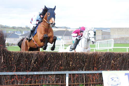 The Mooch jumps the last with Ballyfinboy in second