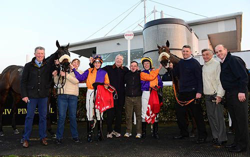 Owner Eugene Kavanagh and son Niall, centre, with War Room, right, and House Limit after they had a one two in the race 