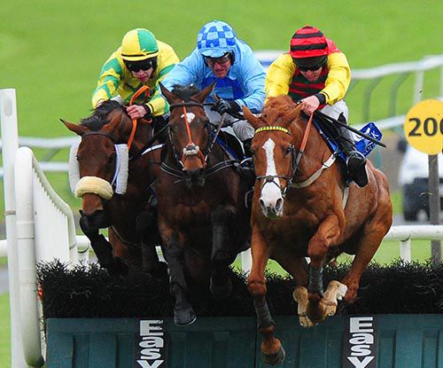 Eight Till Late (right) comes through to lead at the last from Phantom Prince (centre) and Face Value