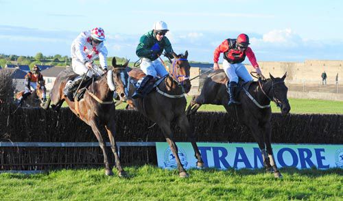 Dante Anna (left), Tomcoole Lad (centre) and Redclue jump the last together 
