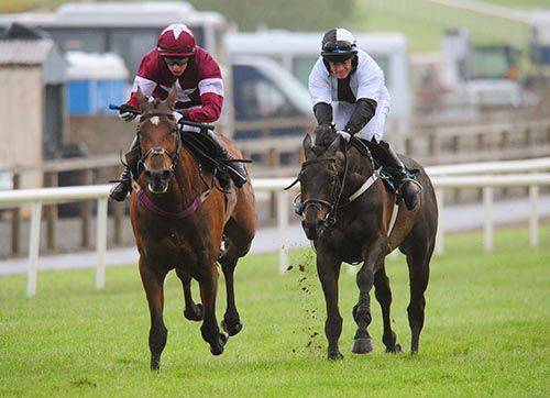 Rawnaq, right, beats Devils Bride in Down Royal