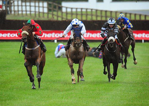Bellgrove (Sean Flanagan, red and green) keeps up the gallop