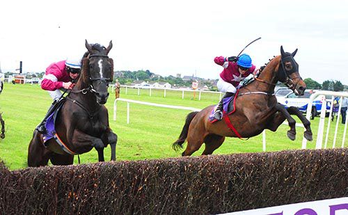 Easter Hunt (nearest) and Officer Cadet jump the last together
