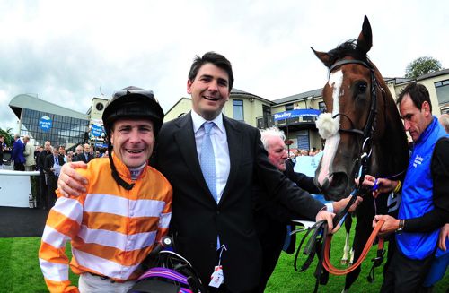 Pat Smullen and Hugo Palmer pictured after Covert Love's win in the 2015 Darley Irish Oaks